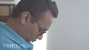 Man flexing his neck to look down