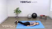 McKenzie method back exercise lying face-down.
