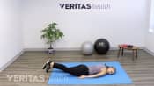 McKenzie method back exercise lying face-down.