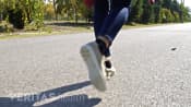 Posterior view of woman walking in a park.