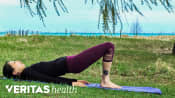 Woman doing a bridge outdoors.