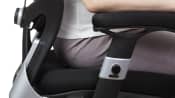 Woman sitting in ergonomic office chair