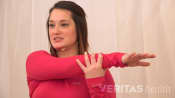 Woman doing a Crossover Shoulder Stretch