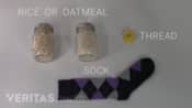 Ingredients for a heat pack including rice or oatmeal, thread, and sock.