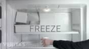 Putting a styrofoam cup in the freezer to freeze.