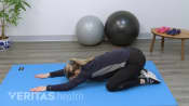 Woman doing a child&#039;s pose