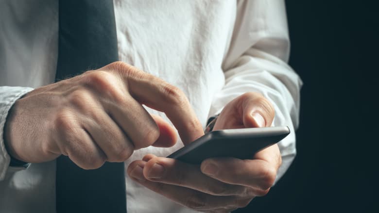 Man texting on his cell phone