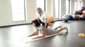 Doing a lying down McKenzie stretch
