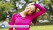 Woman doing gently stretching her neck outdoors