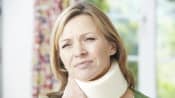 Woman wearing a foam neck brace