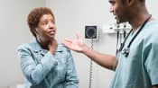 Woman with neck pain and dizziness