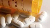 Pills spilled out of a prescription medication bottle