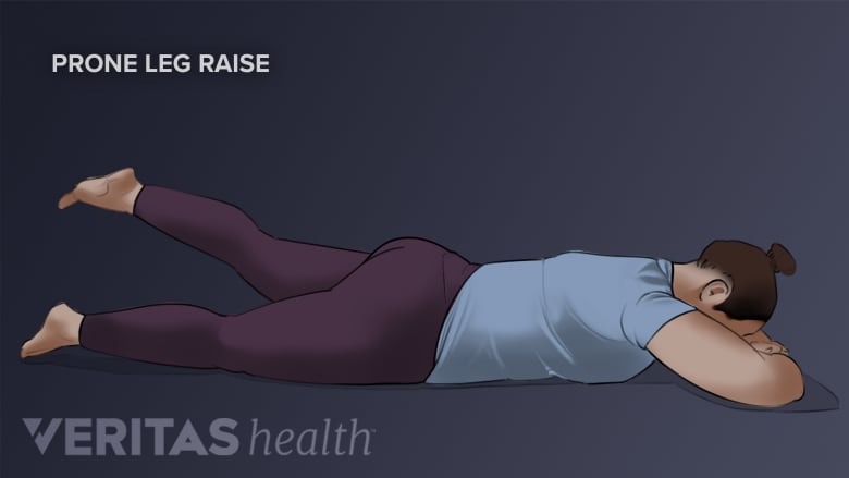 Woman performing prone leg raise