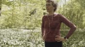 Woman taking a breath on an outdoor walk.