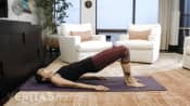 Woman performing bridge exercise for sacroiliac joint pain