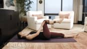 Woman doing the single knee to chest sacroiliac (SI) joint stretch