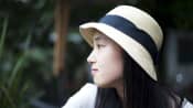 Young woman gazing off thoughtfully