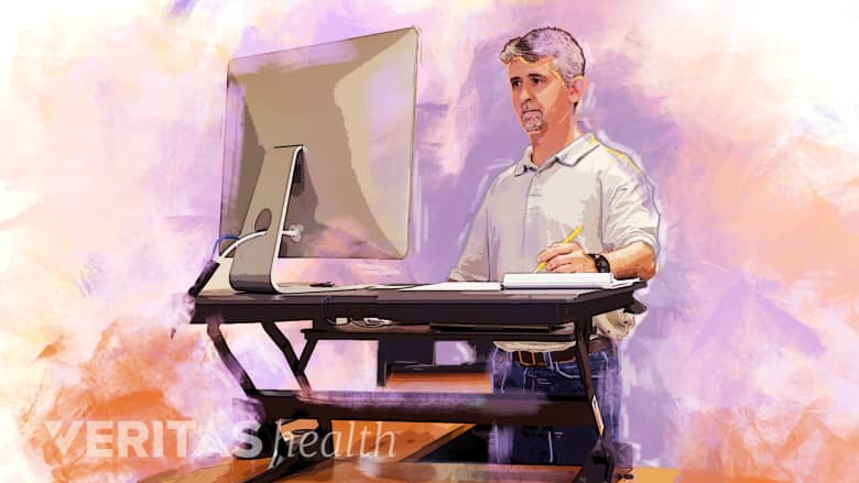 Man working at a standing desk