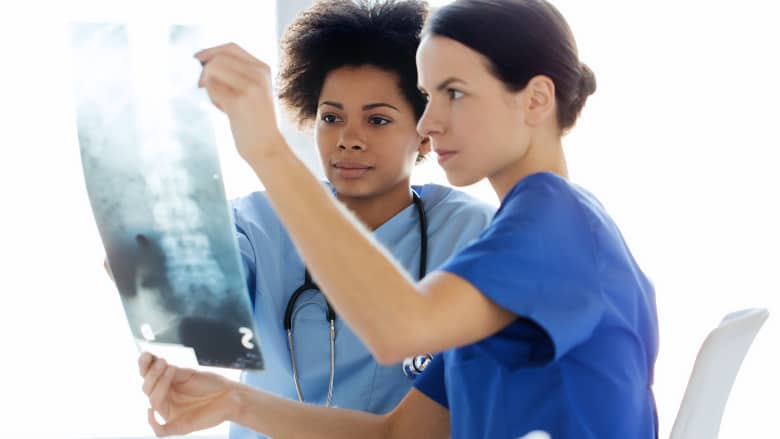 Medical professionals reviewing x-ray
