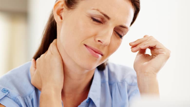 Woman holding her neck in pain