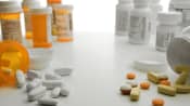 Prescription and non prescription pill bottles some spilledo ut