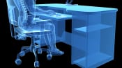 X-ray of person sitting at desk with proper posture