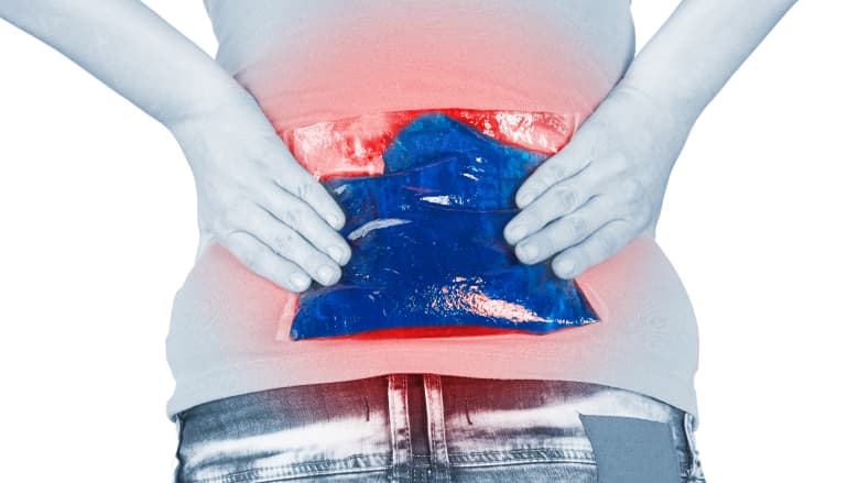 The person holding an ice pack at the lower back.