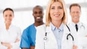 Four hospital professionals including a doctor in the forefront