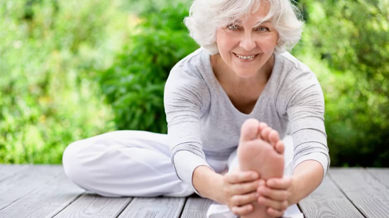 Senior woman doing a hamstring stretch for sciatic pain