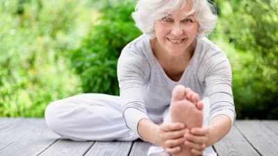 Senior woman doing a hamstring stretch for sciatic pain