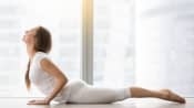 Woman doing the cobra yoga pose