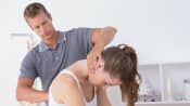 Chiropractor manipulating a patient&#039;s cervical and thoracic spine.