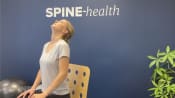 Woman doing next cervical retraction extension