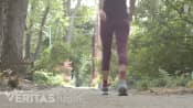 Woman walking on the sidewalk