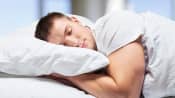 Man sleeping on his stomach
