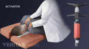Doctor performing activator method on patient