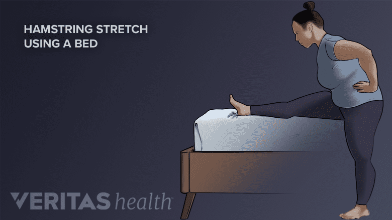 Woman doing a Hamstring Stretch with a bed