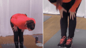 Woman doing a standing hamstring stretch.
