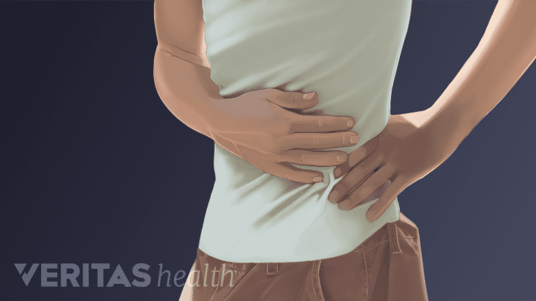 A person having pain in the abdomen.