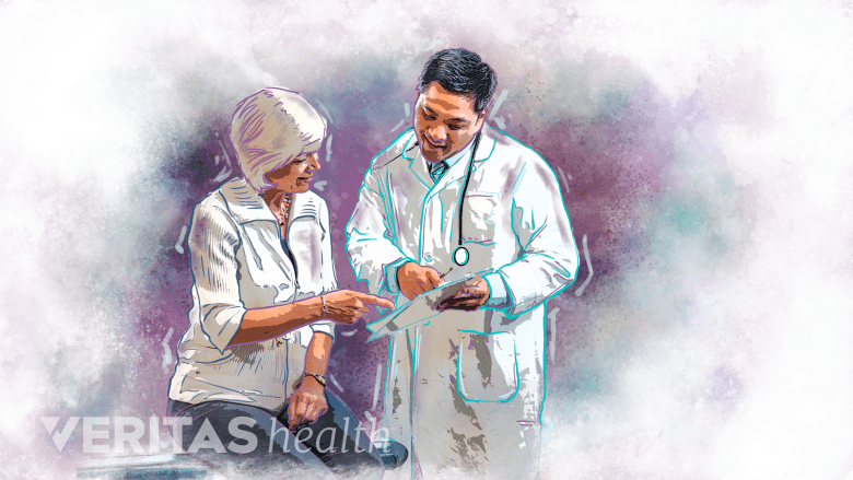 A doctor recording medical history of the patient.