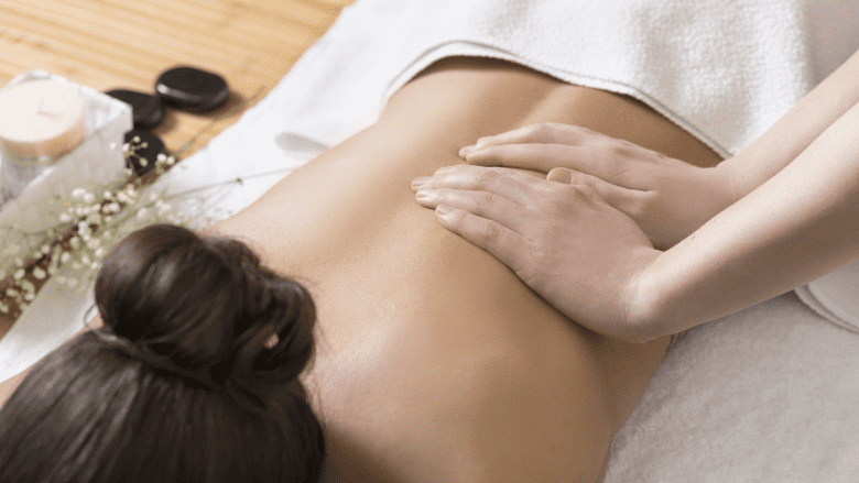 An illustration showing a woman getting massage from a therapist.